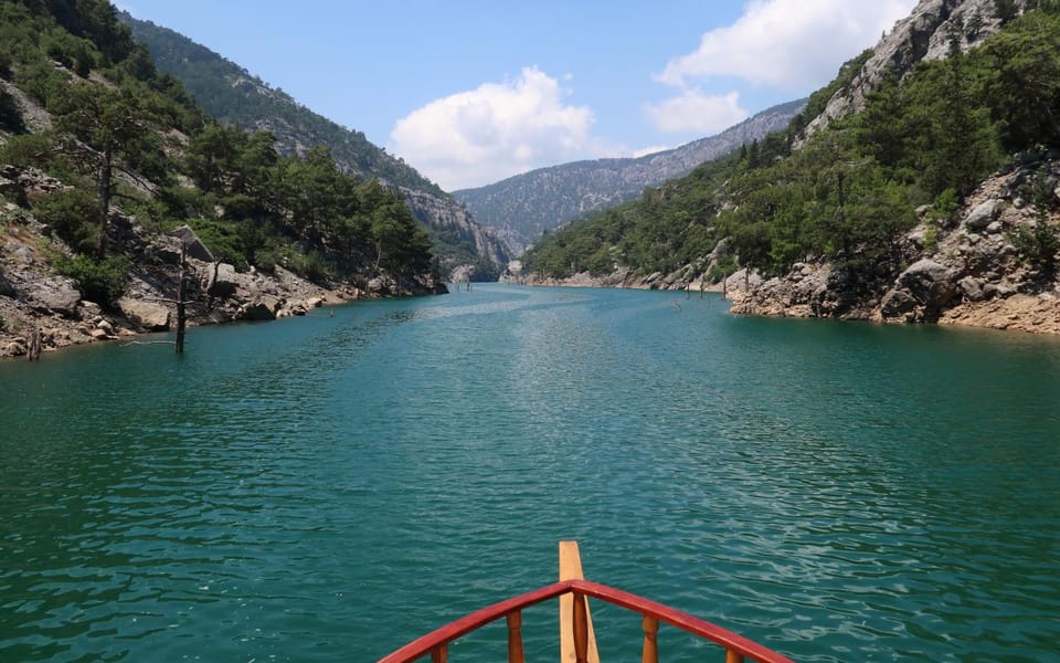 Alanya Green Canyon Boat tour with Lunch and Swimming Breaks - Entering the Water: The Calm Boat Ride and Canyon Views