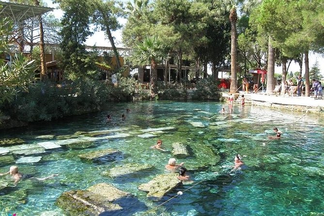 Pamukkale Hierapolis and Cleopatra's Pool Tour with lunch from Antalya - Stop 1: Pamukkale Travertines and the Walk-First Reality