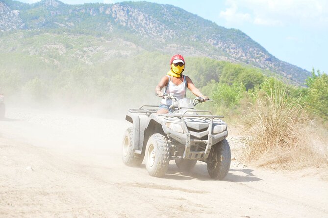 Side: Guided Quad Bike Riding Experience - Showers, Changing Clothes, and Optional DVD/USB Photos